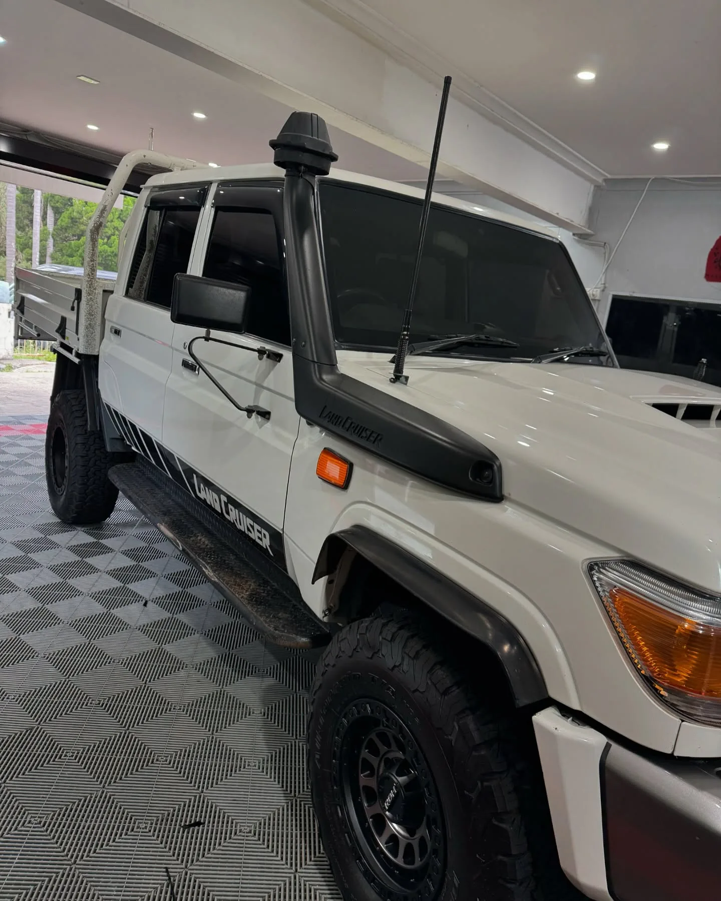 White Toyota LandCruiser ute with dark side windows at Wally’s